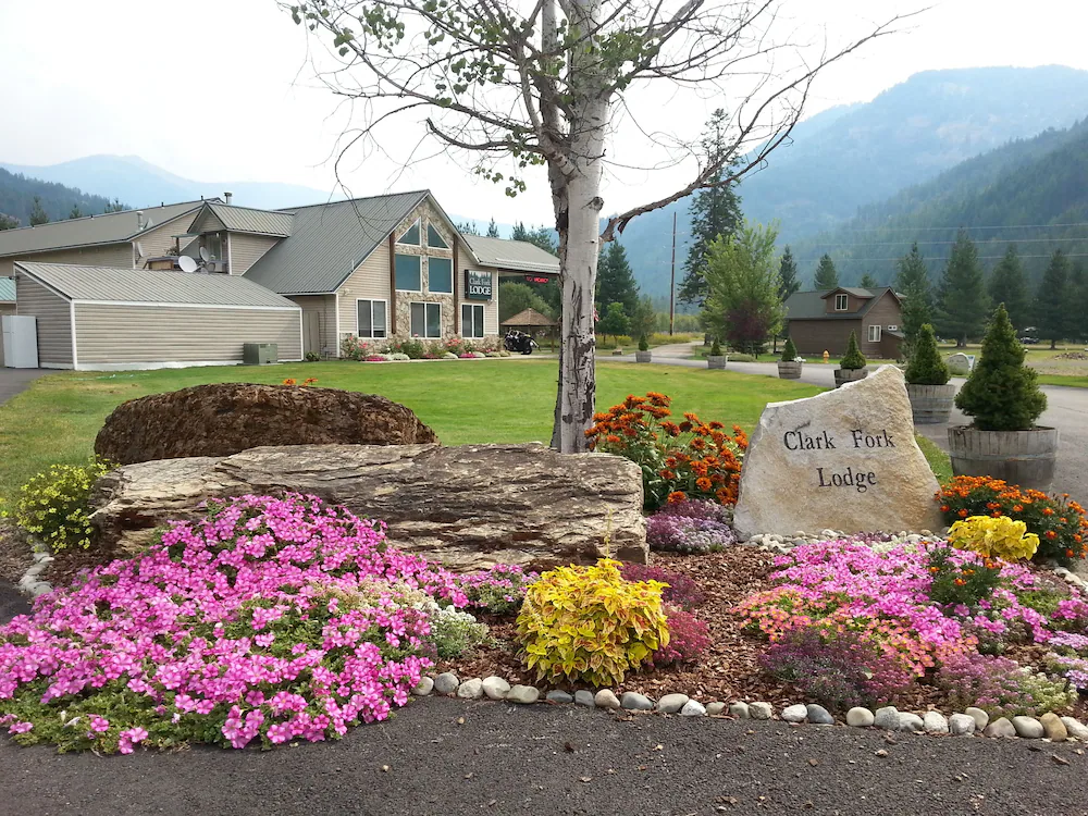entryway drive flower garden at Clark Fork Lodge etched in stone