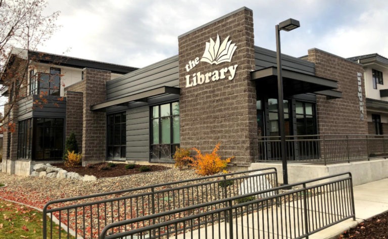 East Bonner County Library building exterior with open book logo signage on Cedar Street in Sandpoint